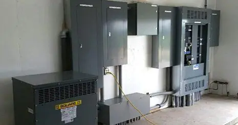 Completed industrial electrical installation with Square D transformer and distribution panels
