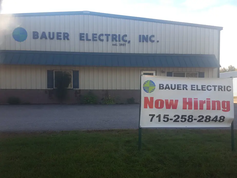 The Bauer Electric shop building on County Highway QQ, Waupaca, with signage reading Bauer Electric, Inc. est. 1957